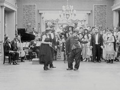 Charles Chaplin, Leota Bryan, Edna Purviance, and John Rand in The Count (1916)