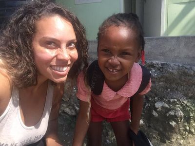 Kelley Kali making a new friend while location scouting in Jacmel, Haiti.