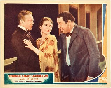 Marguerite Churchill, John Garrick, and Warner Oland in Charlie Chan Carries On (1931)