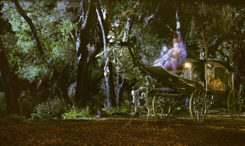 Eddie Murphy, Wallace Shawn, Dina Spybey-Waters, and Aree Davis in The Haunted Mansion (2003)