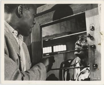 Sidney Poitier and Ken Renard in Something of Value (1957)