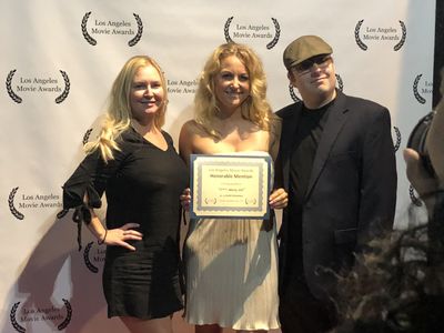 Receiving an award at LA Movie Awards for 'F***, Marry, Kill'