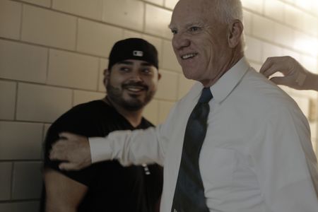 Bryan Ramirez and Malcolm McDowell on set of Sanitarium