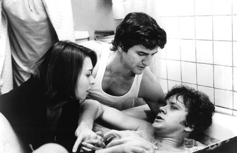 Tim Robbins, Elizabeth Peña, and Anthony Alessandro in Jacob's Ladder (1990)