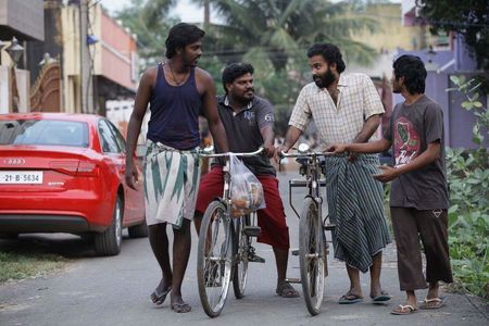 Murugadass, Dinesh, and Raj Pradeesh in Visaaranai (2015)