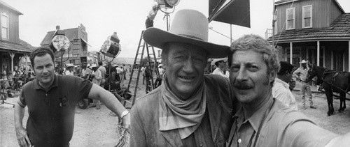 John Wayne and photographer David Sutton on the set of 