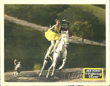 Olive Hasbrouck, Jack Hoxie, and Bunk the Dog in The Fighting Three (1927)