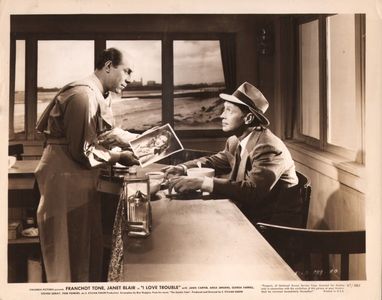 Lynn Merrick, Sid Tomack, and Franchot Tone in I Love Trouble (1948)