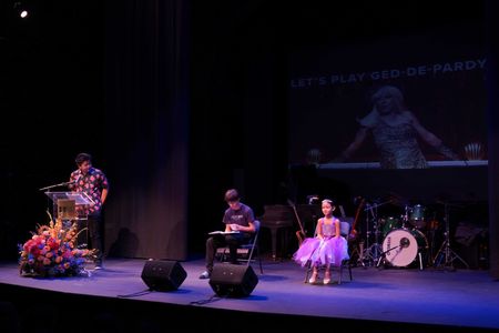 Hudson Yang, Forrest Wheeler and Araceli Prasarttongosoth performing at EWP Night Market