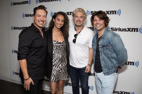 Marissa Hill with Issac Hanson, Taylor Hanson and Zac Hanson at SiriusXM Headquarters