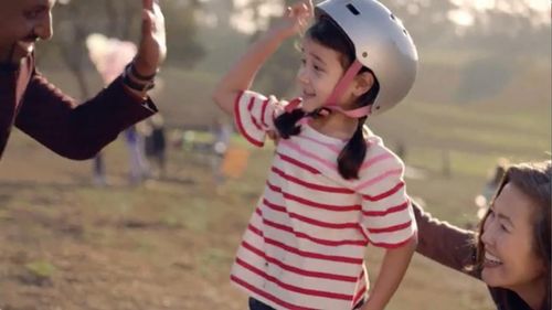 J. Ivy, Araceli Prasarttongosoth and Doris Usui in the AARP commercial 