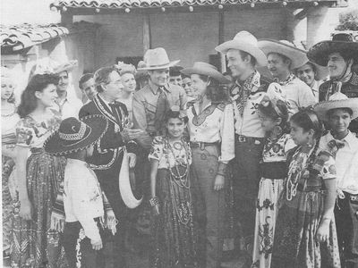 Roy Rogers, Sherry Cameron, Ken Carson, Janet Martin, Duncan Renaldo, Julian Rivero, and Ruth Terry in Hands Across the 