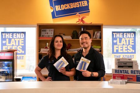 Melissa Fumero and Randall Park in Blockbuster (2022)