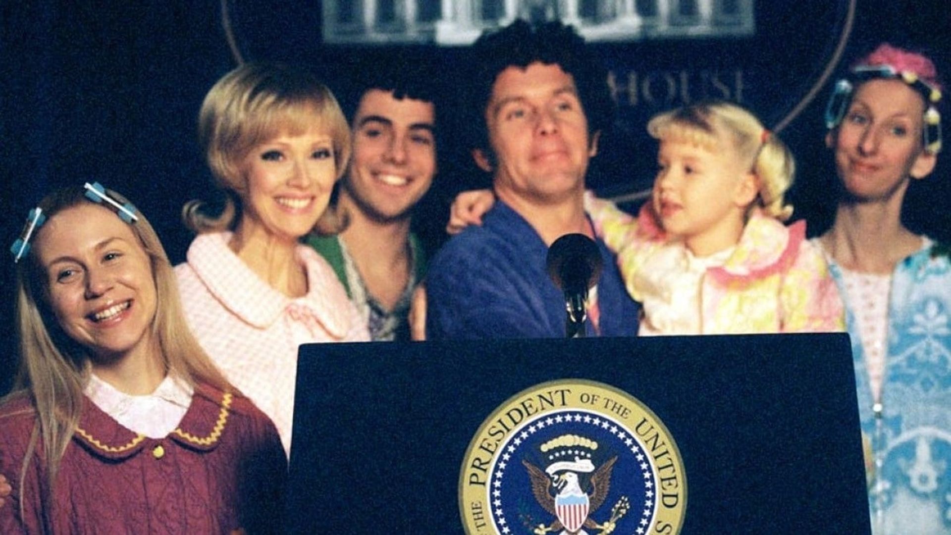 The Brady Bunch in the White House background